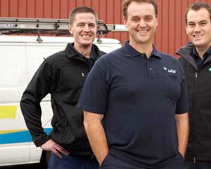 three of our Carmichael plumbers standing ready by their truck